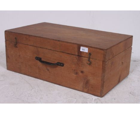 A vintage pine trunk / blanket box suitcase having metal handle. Measures: 23cms x 62cms x 36cms.