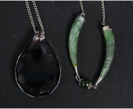 2 silver and jade tooth shaped pendants on silver chain together with a glass teardrop pendant on silver chain