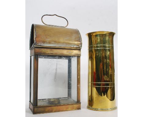 A vintage railway brass carriage lantern together with a brass trench art artillery shell dated 1941