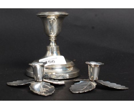 A pair of Danish candle sticks along with another silver hallmarked candle stick.