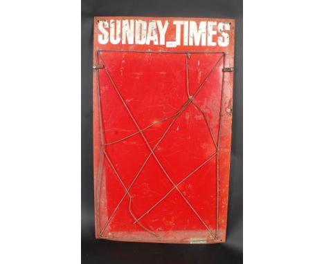 A retro 1970's Sunday Times newspaper enamel metal advertising sign complete with metal tie down mesh.