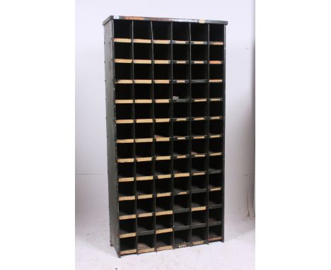 An original mid 20th century Industrial large green enamel metal 72 section cubby cabinet. Each cubby section having painted 