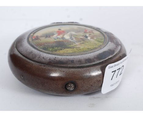 An early 20th century enamel set Brittania metal hunting scene snuff box of circular form. The scene with laquer coating over