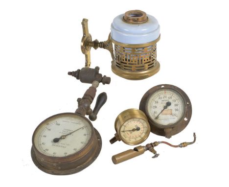 A collection of three full size steam pressure gauges, brass steam whistle and travelling van oil lamp in decorative brass wa