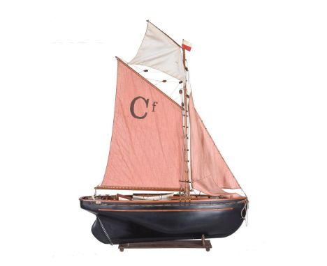 A model of the Bristol channel pilot cutter ‘Cariad’, the model built to 1/24th scale upon a fibre-glass hull. Detailed riggi