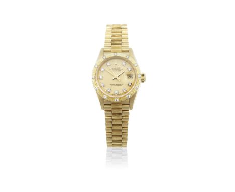 Rolex. A lady's 18K gold and diamond set automatic calendar bracelet watchModel: DatejustReference: 69278Date: Purchased 25th