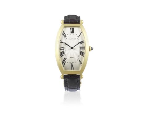 Cartier. An 18K gold manual wind tonneau form wristwatchModel: TonneauReference: 2429/161-90Date: Purchased December 1990Move