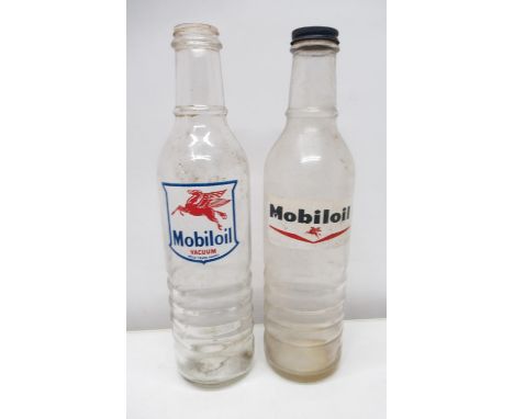 Two Mobil oil glass oil bottles, one with bottle cap 