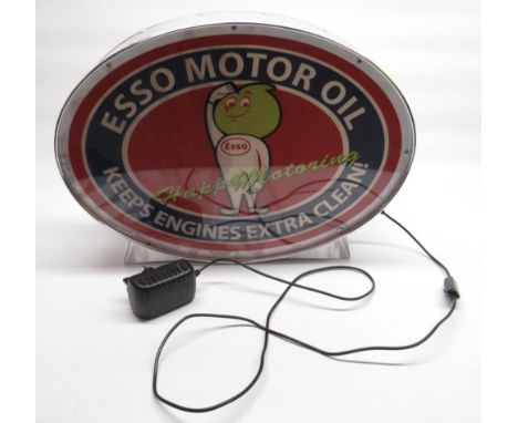 Modern light fitting with Esso  'Happy Motoring' advert 