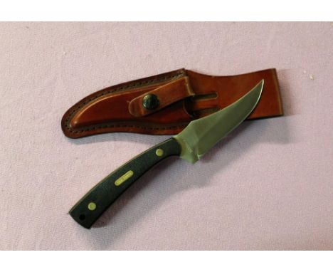 Schrade ("Old Timer) full tang skinning knife, brass rivets with 2 piece macatre and own leather sheath.Blade length 10cmOver