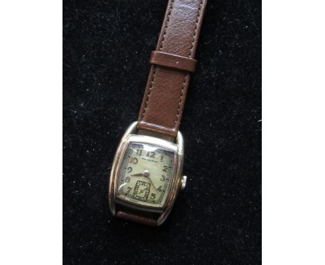 1940's Hamilton Wadsworth gold filled hand wound wristwatch on leather strap, stepped Tonneau case with snap on case back bea