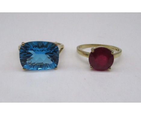 9ct yellow gold ring set with swiss blue topaz, stamped 375, size S, and a 10k yellow gold ring set with ruby, stamped 10k, s