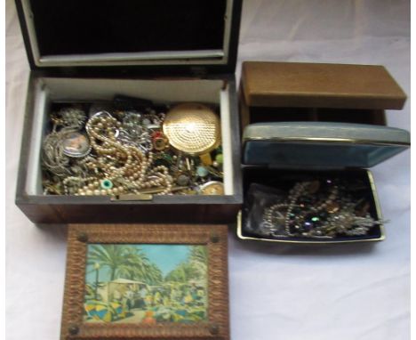 Four jewellery boxes containing a large collection of costume jewellery including pearls, brooches, compact, ear rings etc 