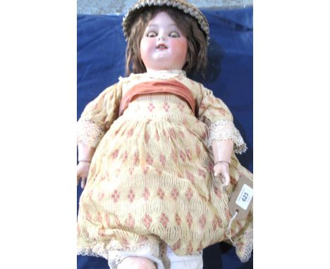 Koppelsdorf doll stamped 250-9, brown wig, wearing a cream and pink dress with sash, straw hat, shoes, H67cm 