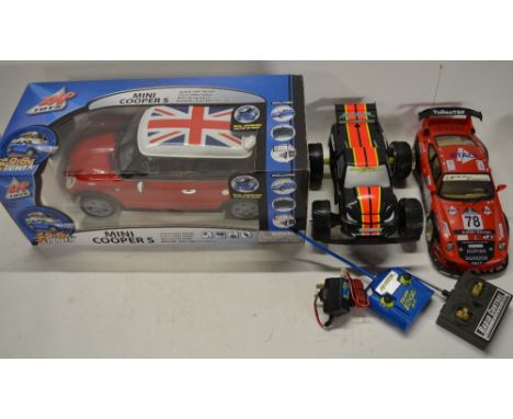 Three working radio control cars including a boxed Mini Cooper (also a radio) by Zap Toys, a Porsche 911 by Great Power and a