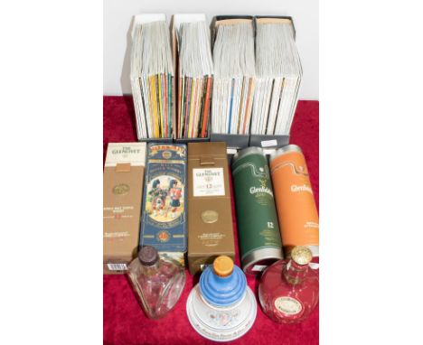 Two Glenfidddich Whisky flask type containers, two Glenlivet leather effect cartons, Glen Moray Black Watch tin Dimple bottle