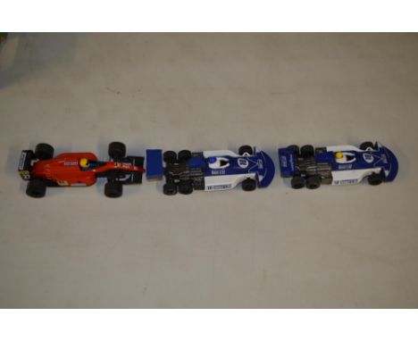 Three  1/32 Scalextric Formula 1 race cars by Hornby. 2x Ford 240 6 wheelers and a Ferrari. All in good used condition, pleas