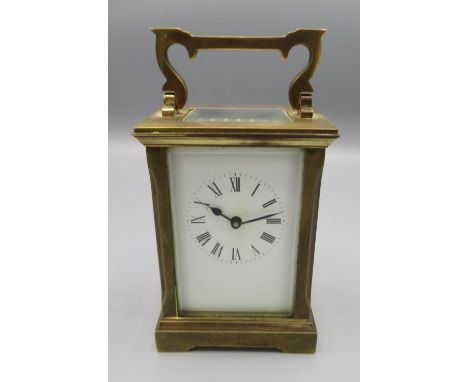 C20th brass carriage time piece, with white enamel Roman dial, movement stamped with makers monogram, later replacement platf