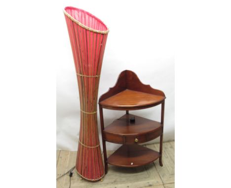 Late C20th mahogany 3-tier corner whatnot, with single frieze drawer and a Rattan style standard lamp with red canvas (2) 
