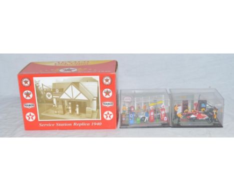 2 Schuco 1/43 diorama model sets, one with an MGB at a service station, the other a racing set and a Texaco "Old-Timer" servi