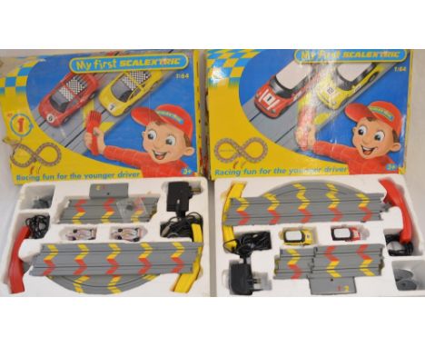 Large quantity of 1/32 Scalextric track, barriers, 4 controllers etc, and 2 boxed 1/64 scale "My First Scalextric" sets (one 