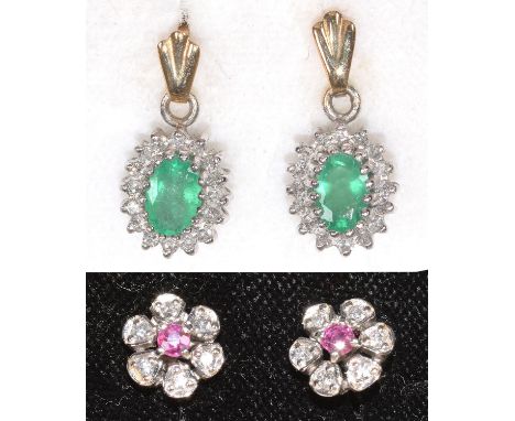 A PAIR OF RUBY AND DIAMOND FLOWER STUD EARRINGS IN 9CT WHITE GOLD AND A PAIR OF EMERALD AND DIAMOND DROP EARRINGS IN 9CT GOLD