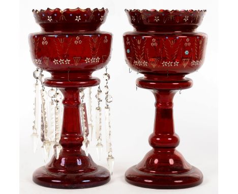 A PAIR OF LATE VICTORIAN ENAMELLED AND GILT RUBY GLASS LUSTRES, 35CM H, ONE LACKING DROPS 