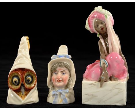 A ROYAL WORCESTER FIGURE OF THE THIEF, 11CM H, BLACK PRINTED MARK, RD NUMBER AND 3145 AND TWO ROYAL WORCESTER CANDLE SNUFFERS