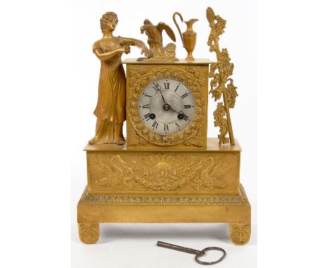 A FRENCH EMPIRE ORMOLU CLOCK, THE DIAL FLANKED BY ______________________ AND THYRSUS, SURMOUNTED BY JUPITER AS AN EAGLE ON CL