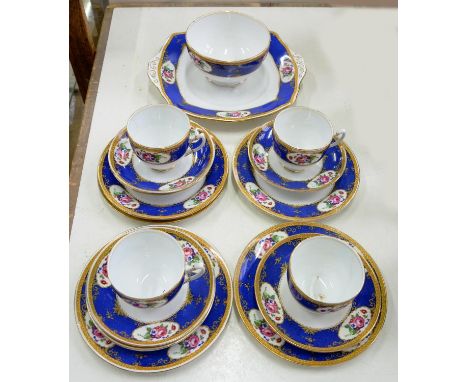 A ROYAL ALBERT BONE CHINA FLORAL TEA SERVICE WITH BLUE BORDER, PRINTED MARK 