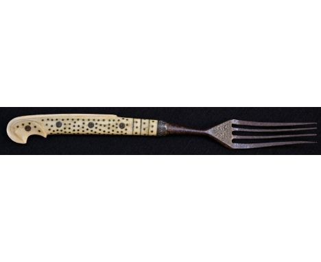 A late 17th/early 18th century Ottoman piqué, bone and steel fork, the four-prongs above a damascened foliage in the Islamic 