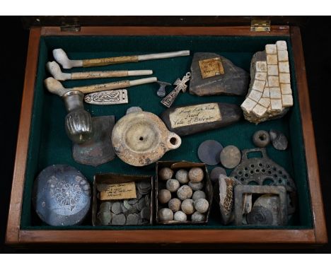 Wunderkammer - an antiquary's table-top 'museum' of archaeological finds, the diorama enclosing a Roman iridescent glass phia