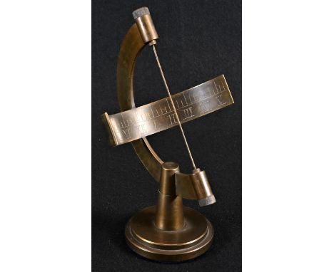 A brass desk top armillary sundial, hemisphere scale engraved with Roman numerals, 19.5cm high 