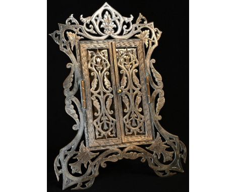 A 19th century EP novelty easel photograph frame, as an elaborate doorway, the bi-partite doors pierced with scrollwork and e