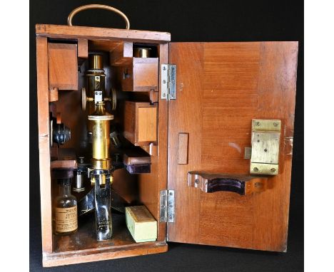A lacquered and black painted brass monocular microscope, by E Leitz, Wetzlar, No.63710, rack-and-pinion adjustment, twin obj