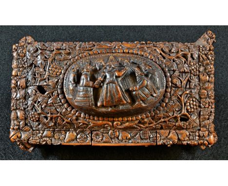 An early 19th century coquilla nut casket, hinged cover with an oval panel carved in relief with figures, on a ground of blos