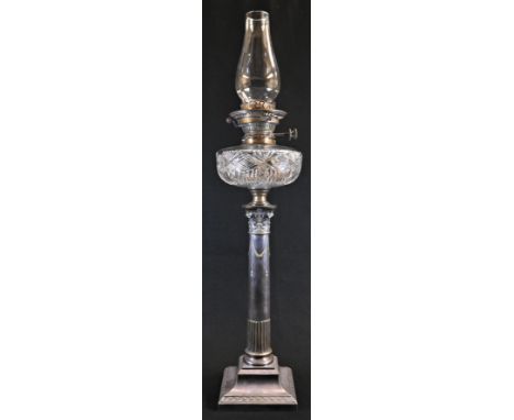 An Edwardian E.P.N.S Corinthian column table oil lamp, Hinks No.2 patent burner, cut glass reservoir, the pillar part-fluted 