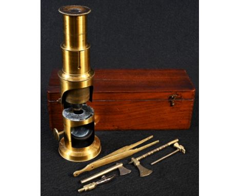 A 19th century botanist's lacquered brass monocular microscope and equipage, including a pair of tweezers, two graduating axe