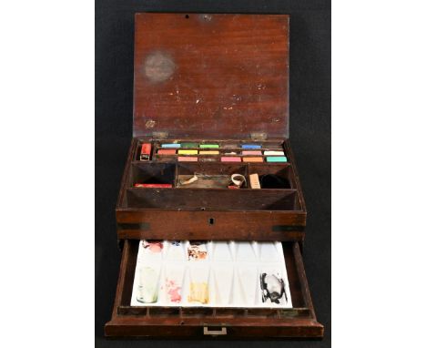 A George III/IV brass bound mahogany artist's box, hinged cover enclosing provision for paint, brushes and painting requisite