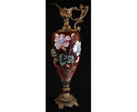 A large Rococo Revival gilt-metal mounted ewer, the ovoid ceramic reservoir painted in colourful polychrome with poppies on a