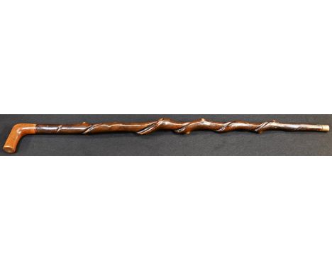 A 19th century folk art walking stick, twisted haft, the L-shaped handle inscribed in penwork ?J Stowe?, 88cm long 