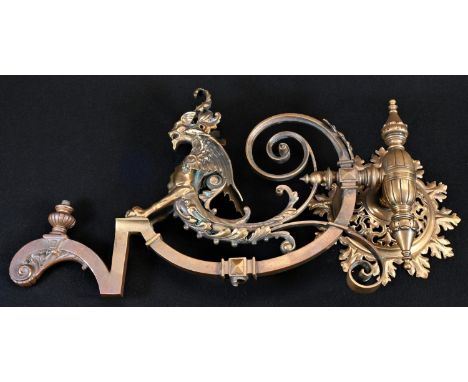 A 19th century gilt brass gas light wall bracket, cast in the Renaissance Revival taste with a dragon herm and scrolling acan
