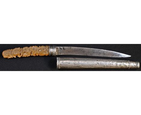 A Burmese dha type dagger, 17.5cm blade, the horn handle carved with deities, silver coloured metal scabbard, 30cm long overa