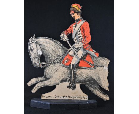 A dummy board type table top military silhouette figure, Private: 17th Light Dragoons 1760, printed in polychrome, 32.5cm hig