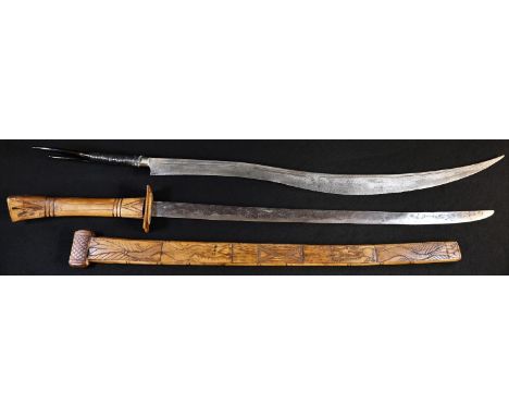 A Chinese sword, 56.5cm straight single-edged blade, horn hilt and scabbard, carved with ferocious dragons, 80cm long; anothe