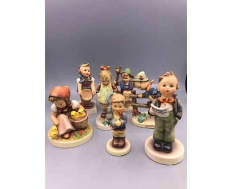 A selection of seven Hummel figures