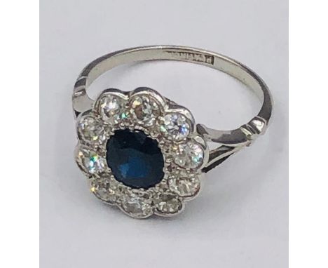 A Sapphire and Diamond Daisy ring on a platinum band (4.1g) 