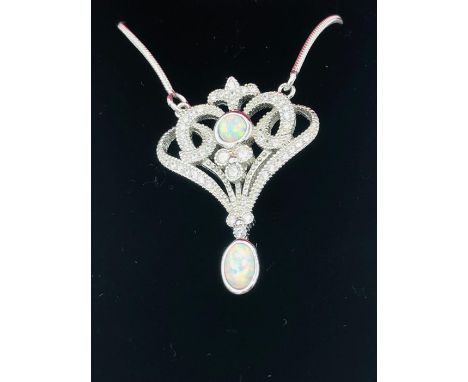 A silver and opal set pendant necklace