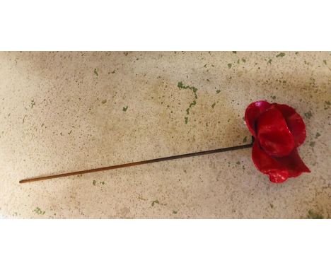 A Ceramic Poppy from the Tower of London  'Blood Swept Lands and Seas of Red' installation by Paul Cummins. All proceeds from