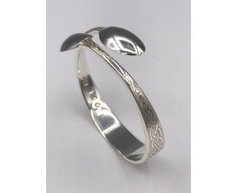 A silver bangle, Artisan made from silver spoons